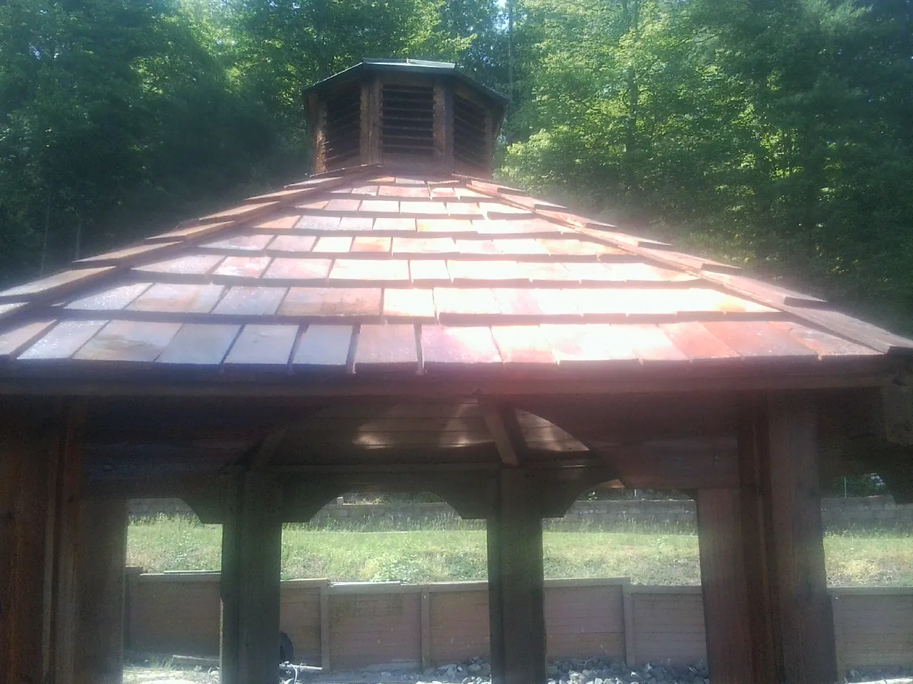 New cedar shake roof and cupola on a lakeside gazebo in Barberton